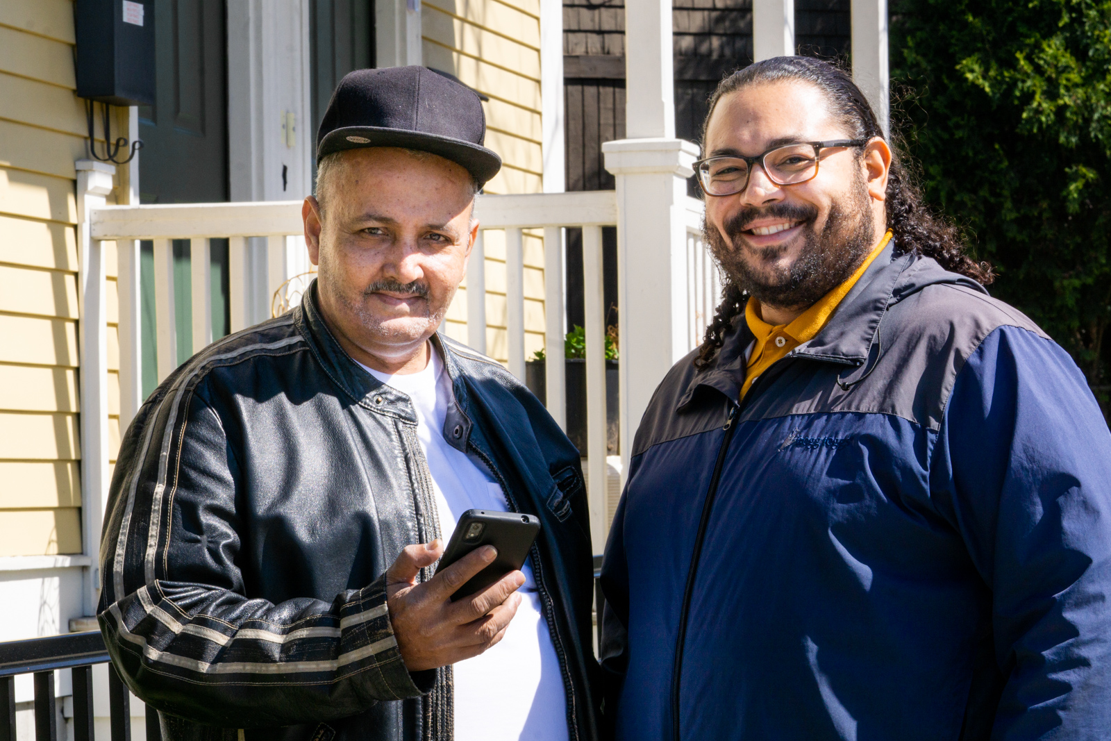 Harry Quiñones, left, of Providence, works with Antonio Rodriguez, ONE|NB’s Assistant Director of Asset Management, ensuring he's fully connected to the free neighborhood WiFi.