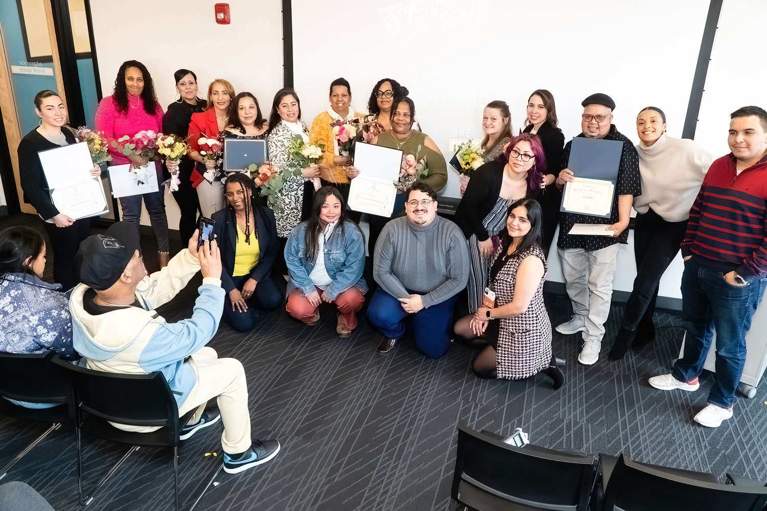 The first graduates of the pre-apprenticeship Mission Program pose for a picture at CIC in Providence after receiving their graduation certificates. Photo by Stephen Ide/ONE Neighborhood Builders.