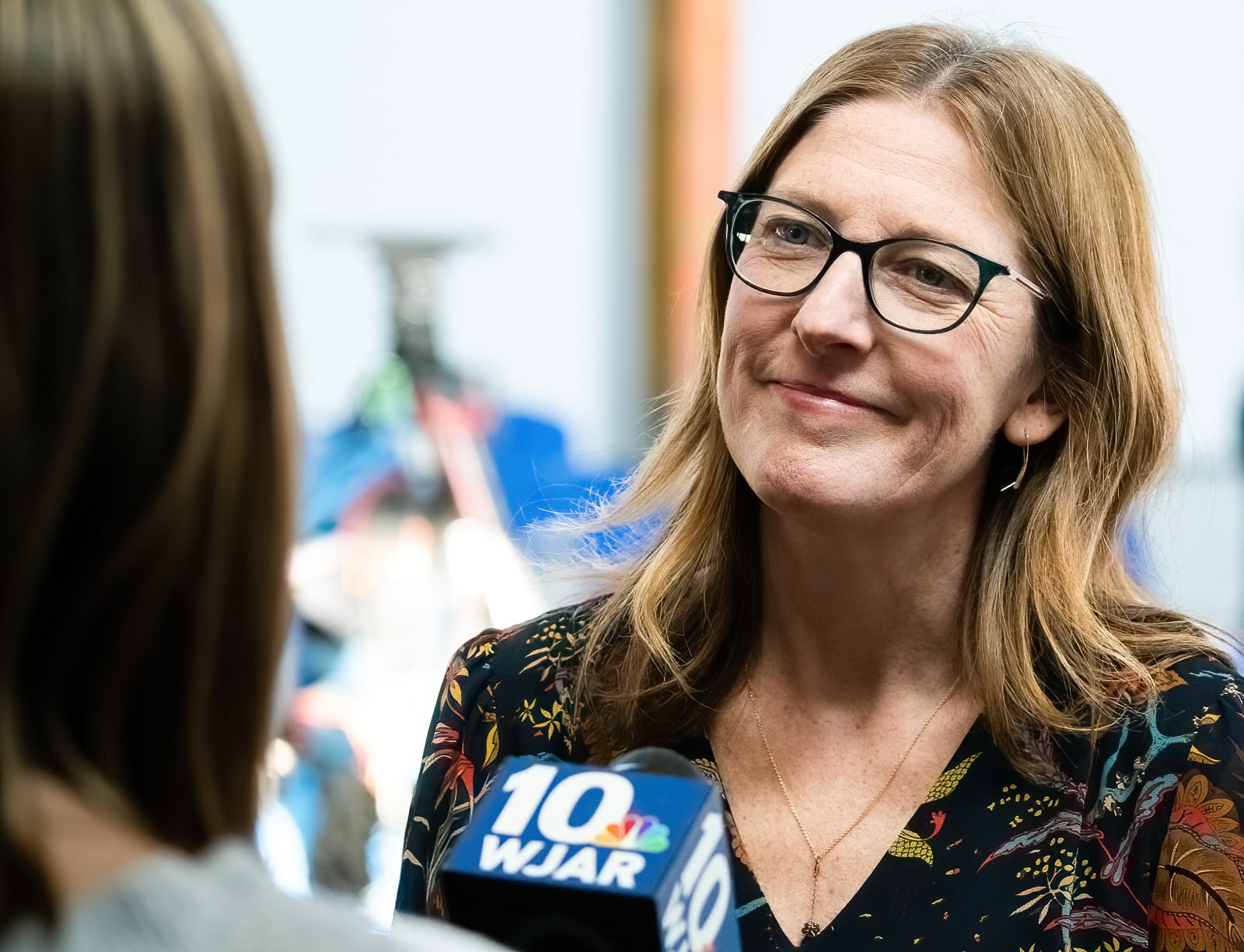 Jennifer Hawkins, Executive Director of ONE Neighborhood Builders, speaks to a reporter at the Roadmap release event on Monday, March 27, 2023