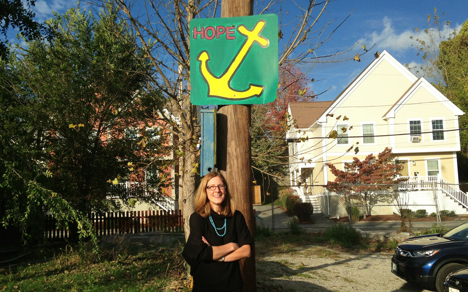 Jennifer Hawkins, director of the ONE Neighborhood Builders community development corporation, standing in Riverside Park, with some of the new homes her group has developed in Olneyville behind her, during a trolley tour organized by Rhode Island Housing in 2017. Photo by Richard Asinof/ConvergenceRI