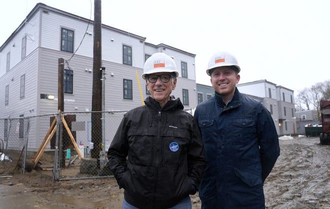 Steve Kearns, real estate project manager and Kyle McKendall, vice president of resource development and communications for One Neighborhood Builders. Kris Craig/The Providence Journal