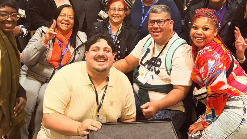 Dennis González, front left, our Housing Programs Manager, poses with a group of participants at NTI in San Francisco.